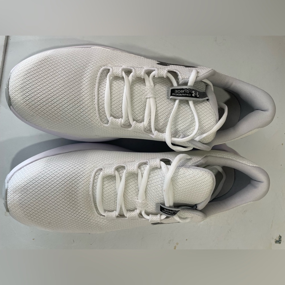 Under Armour size 14 men’s Charged Surge white tennis shoes
